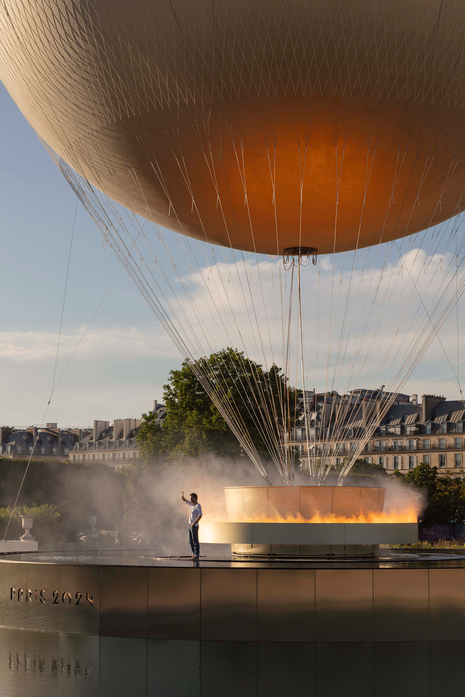 Mathieu Lehanneur alongside the Paris 2024 Olympic Cauldron in the Tuileries Garden